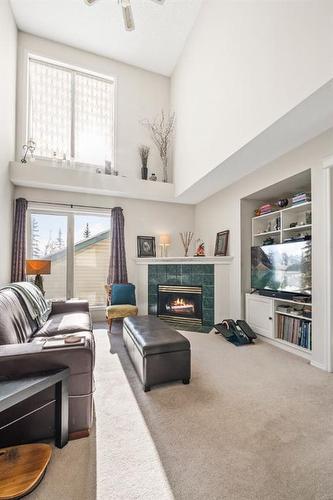 212 Tuscany Valley Way Nw, Calgary, AB - Indoor Photo Showing Living Room With Fireplace