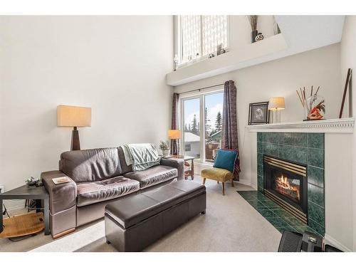 212 Tuscany Valley Way Nw, Calgary, AB - Indoor Photo Showing Living Room With Fireplace