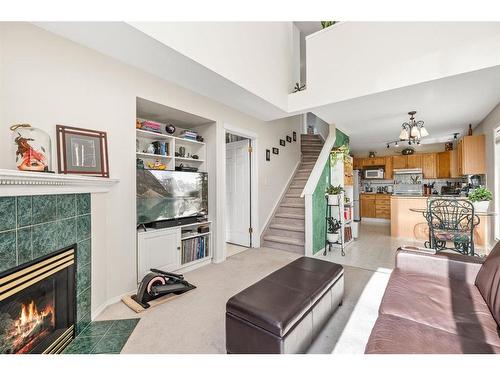 212 Tuscany Valley Way Nw, Calgary, AB - Indoor Photo Showing Living Room With Fireplace