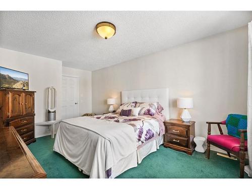 212 Tuscany Valley Way Nw, Calgary, AB - Indoor Photo Showing Bedroom