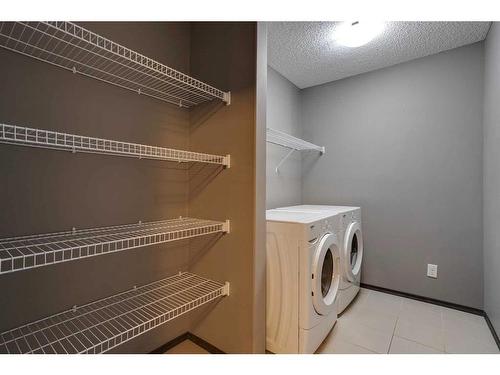 692 New Brighton Drive Se, Calgary, AB - Indoor Photo Showing Laundry Room