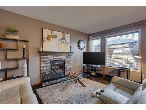 692 New Brighton Drive Se, Calgary, AB - Indoor Photo Showing Living Room With Fireplace