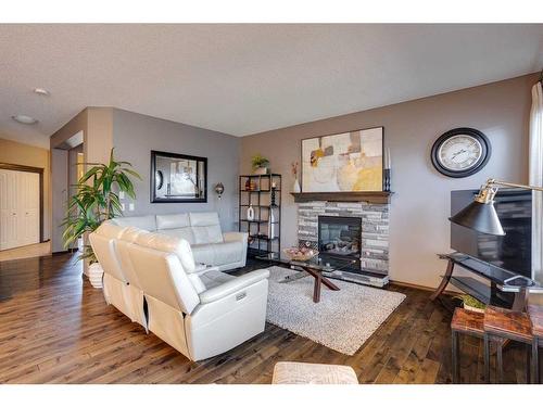 692 New Brighton Drive Se, Calgary, AB - Indoor Photo Showing Living Room With Fireplace