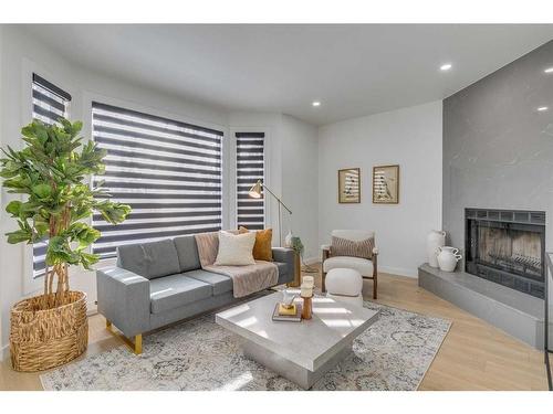 72 Mckenna Way Se, Calgary, AB - Indoor Photo Showing Living Room With Fireplace