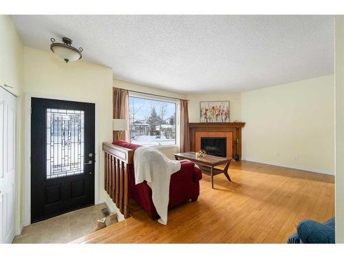 8 Oakvale Place Sw, Calgary, AB - Indoor Photo Showing Other Room With Fireplace