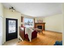 8 Oakvale Place Sw, Calgary, AB  - Indoor Photo Showing Other Room With Fireplace 