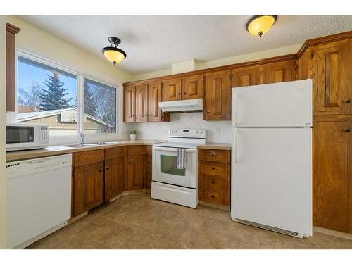 8 Oakvale Place Sw, Calgary, AB - Indoor Photo Showing Kitchen With Double Sink