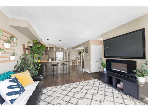 39 Ranch Glen Drive Nw, Calgary, AB - Indoor Photo Showing Other Room With Fireplace