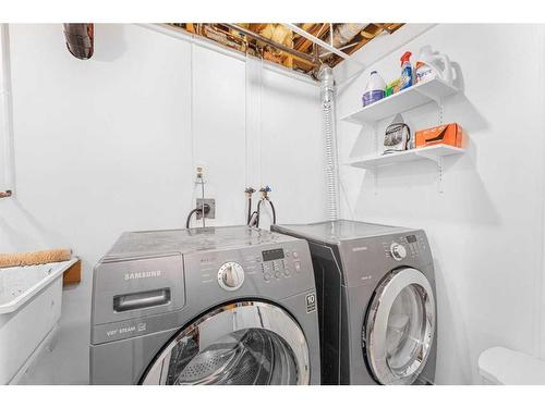 39 Ranch Glen Drive Nw, Calgary, AB - Indoor Photo Showing Laundry Room