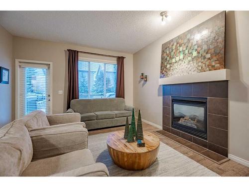 98 Everwoods Link Sw, Calgary, AB - Indoor Photo Showing Living Room With Fireplace