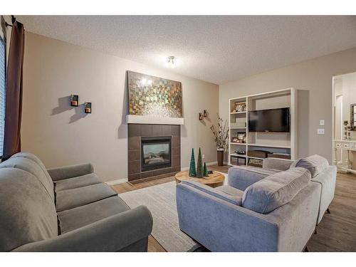 98 Everwoods Link Sw, Calgary, AB - Indoor Photo Showing Living Room With Fireplace