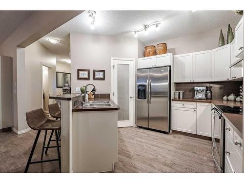 98 Everwoods Link Sw, Calgary, AB - Indoor Photo Showing Kitchen With Double Sink