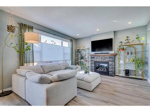 56 Elgin Meadows Link Se, Calgary, AB - Indoor Photo Showing Living Room With Fireplace