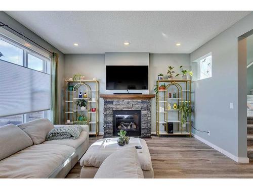 56 Elgin Meadows Link Se, Calgary, AB - Indoor Photo Showing Living Room With Fireplace