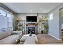 56 Elgin Meadows Link Se, Calgary, AB  - Indoor Photo Showing Living Room With Fireplace 