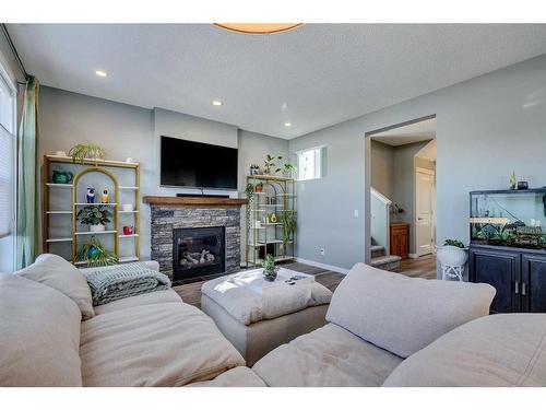 56 Elgin Meadows Link Se, Calgary, AB - Indoor Photo Showing Living Room With Fireplace