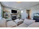 56 Elgin Meadows Link Se, Calgary, AB  - Indoor Photo Showing Living Room With Fireplace 