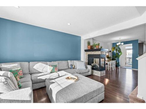 310 Nolan Hill Drive Nw, Calgary, AB - Indoor Photo Showing Living Room With Fireplace