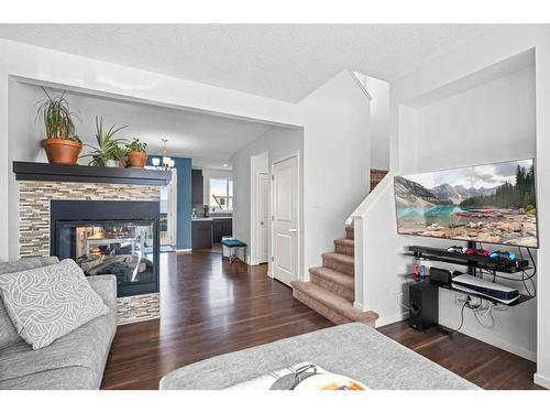 310 Nolan Hill Drive Nw, Calgary, AB - Indoor Photo Showing Living Room With Fireplace