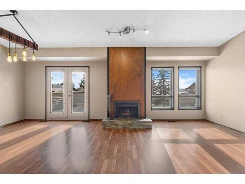 52 Hawkcliff Way Nw, Calgary, AB - Indoor With Fireplace