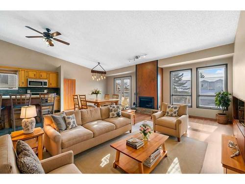 52 Hawkcliff Way Nw, Calgary, AB - Indoor Photo Showing Living Room With Fireplace