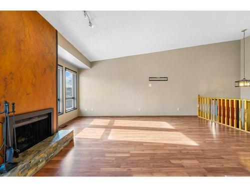 52 Hawkcliff Way Nw, Calgary, AB - Indoor With Fireplace