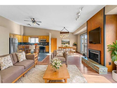 52 Hawkcliff Way Nw, Calgary, AB - Indoor Photo Showing Living Room With Fireplace