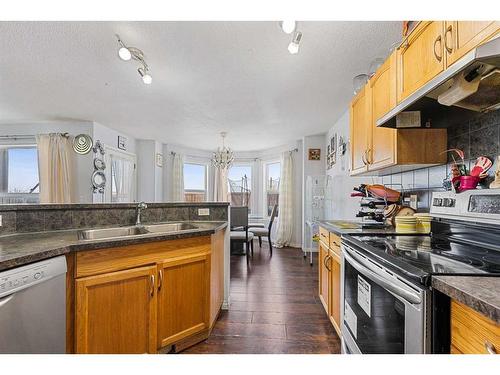 253 Saddlecrest Way Ne, Calgary, AB - Indoor Photo Showing Kitchen With Double Sink