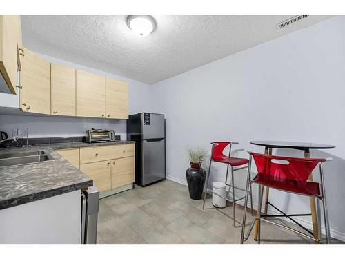 253 Saddlecrest Way Ne, Calgary, AB - Indoor Photo Showing Kitchen With Double Sink