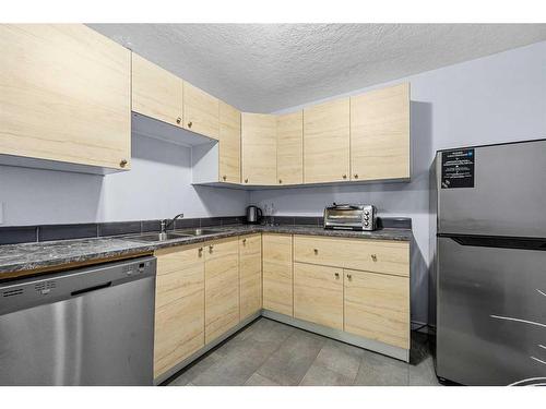 253 Saddlecrest Way Ne, Calgary, AB - Indoor Photo Showing Kitchen With Double Sink