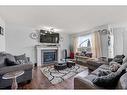 253 Saddlecrest Way Ne, Calgary, AB  - Indoor Photo Showing Living Room With Fireplace 