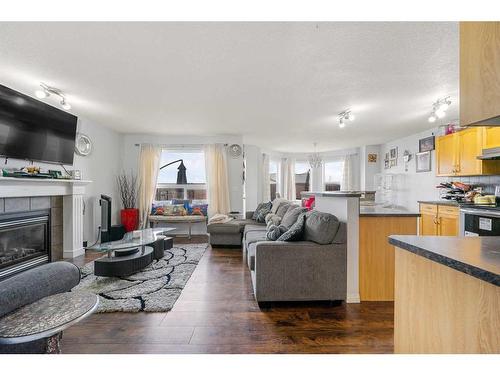 253 Saddlecrest Way Ne, Calgary, AB - Indoor Photo Showing Living Room With Fireplace