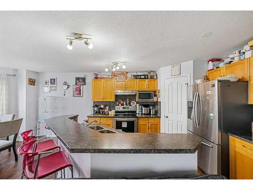 253 Saddlecrest Way Ne, Calgary, AB - Indoor Photo Showing Kitchen With Double Sink