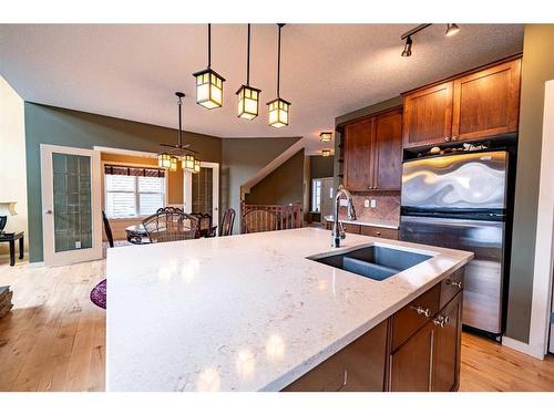 48 Chapala Square Se, Calgary, AB - Indoor Photo Showing Kitchen With Double Sink