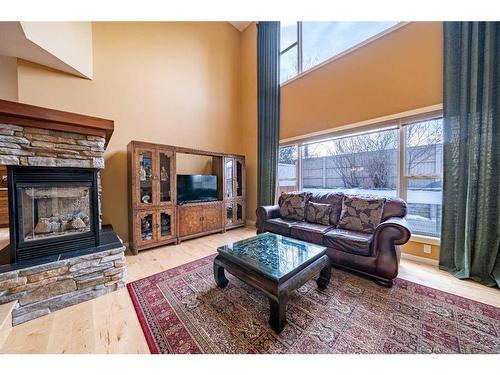 48 Chapala Square Se, Calgary, AB - Indoor Photo Showing Living Room With Fireplace