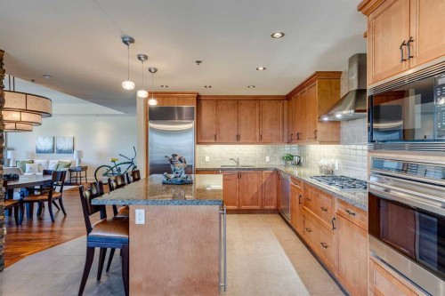702-600 Princeton Way Sw, Calgary, AB - Indoor Photo Showing Kitchen With Stainless Steel Kitchen With Upgraded Kitchen