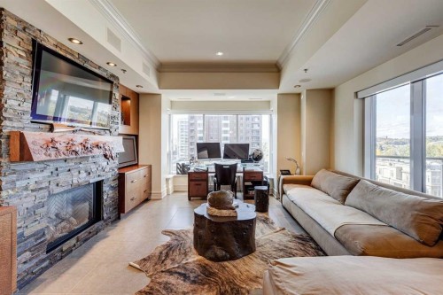 702-600 Princeton Way Sw, Calgary, AB - Indoor Photo Showing Living Room With Fireplace