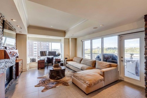 702-600 Princeton Way Sw, Calgary, AB - Indoor Photo Showing Living Room With Fireplace