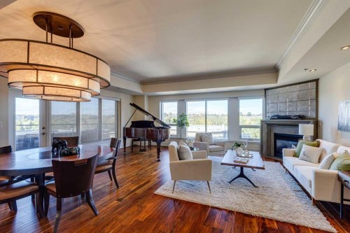 702-600 Princeton Way Sw, Calgary, AB - Indoor Photo Showing Living Room With Fireplace