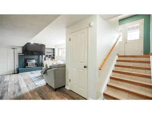 127 Ranchview Mews Nw, Calgary, AB - Indoor With Fireplace