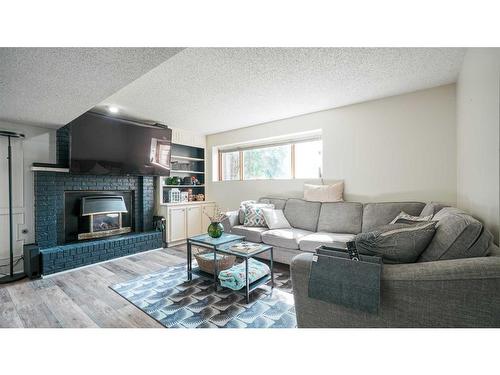 127 Ranchview Mews Nw, Calgary, AB - Indoor Photo Showing Living Room With Fireplace