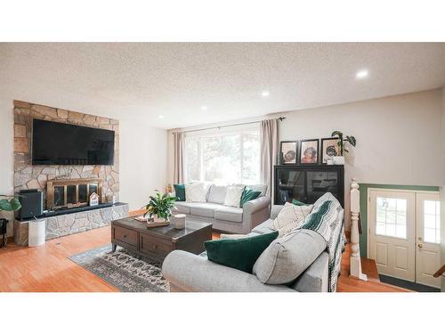 127 Ranchview Mews Nw, Calgary, AB - Indoor Photo Showing Living Room With Fireplace