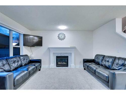 143 Taralake Way Ne, Calgary, AB - Indoor Photo Showing Living Room With Fireplace