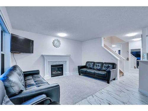 143 Taralake Way Ne, Calgary, AB - Indoor Photo Showing Living Room With Fireplace