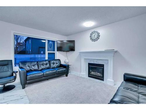 143 Taralake Way Ne, Calgary, AB - Indoor Photo Showing Living Room With Fireplace