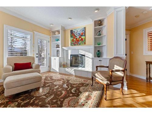 55 Prominence Point Sw, Calgary, AB - Indoor Photo Showing Living Room With Fireplace