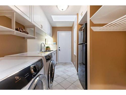 55 Prominence Point Sw, Calgary, AB - Indoor Photo Showing Laundry Room