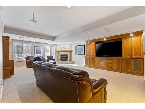 55 Prominence Point Sw, Calgary, AB - Indoor Photo Showing Living Room With Fireplace