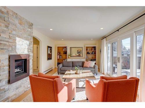 73 Holden Road Sw, Calgary, AB - Indoor Photo Showing Living Room With Fireplace