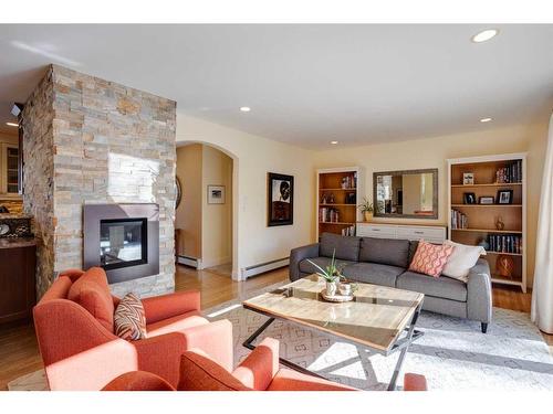 73 Holden Road Sw, Calgary, AB - Indoor Photo Showing Living Room With Fireplace